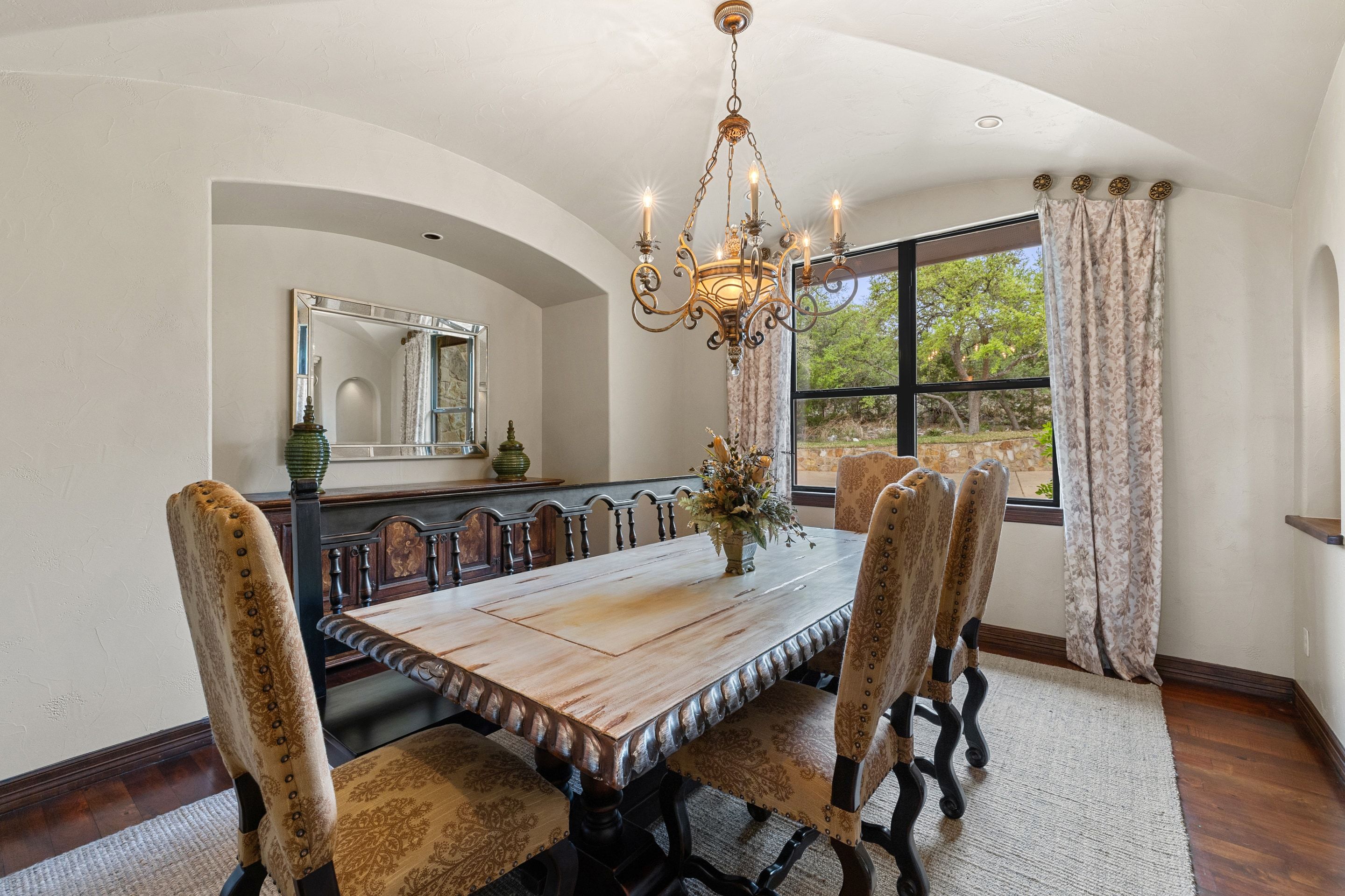 Formal dining room at Lakehaven with chandelier lighting and tall ceilings