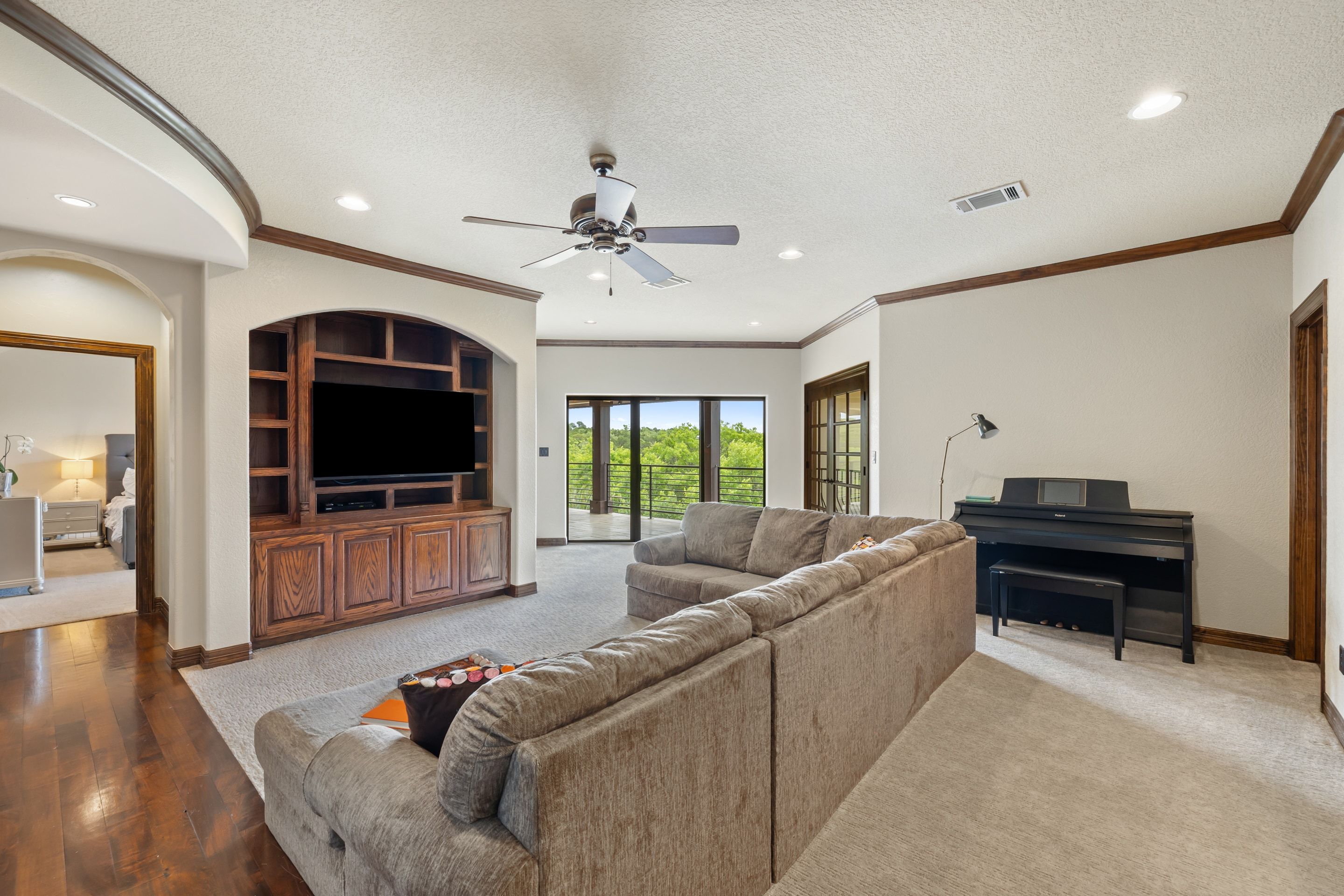 Upstairs game room at Lakehaven opening toward the covered veranda and long views
