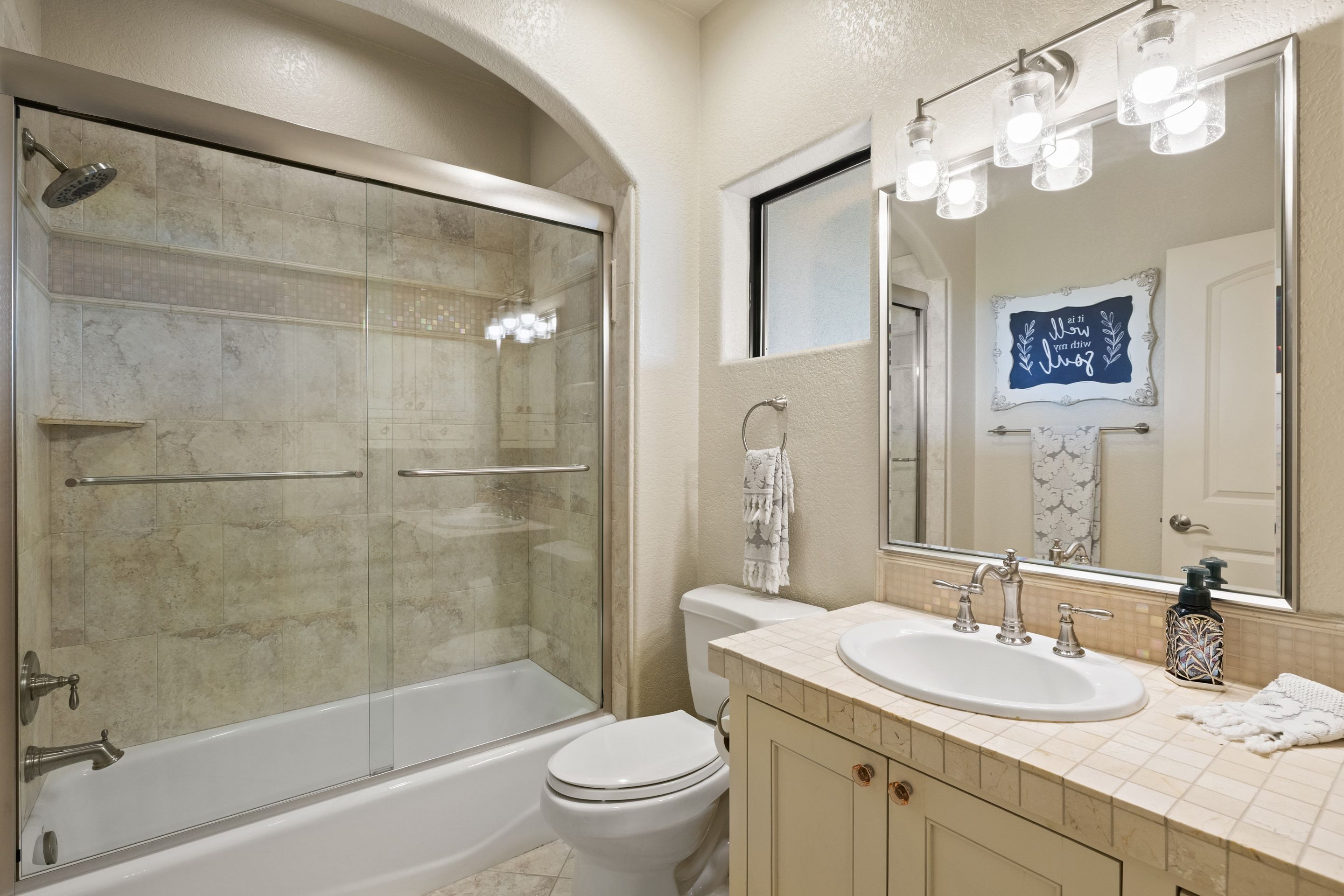 Updated guest bath at Lakehaven with a glass shower enclosure